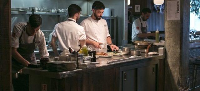 Josẽ Pizarro Restaurant in Bermondsey, London. Open kitchen with a view of the chefs