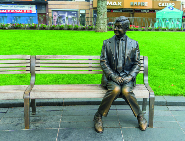 Rowan Atkinson Bronze Statue of Mr Bean,Sitting On A Bench, Leicester Square, London