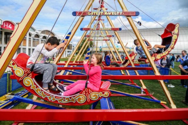 Famly enjoying the vintage Funfair RAF Museum