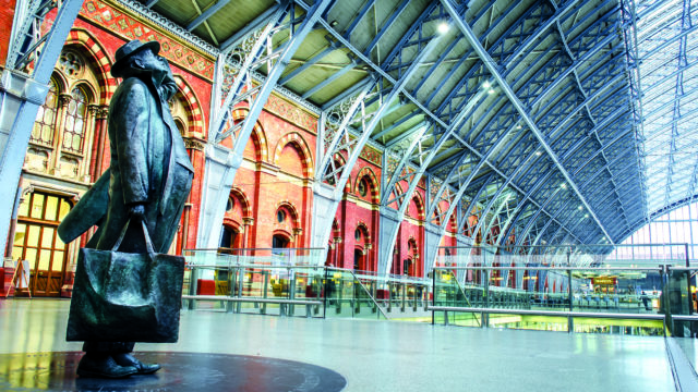 Statue of passenger inside London's St Pancras International train station