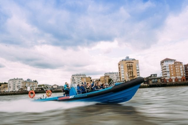 ThamesJet Extreme speedboat flies down the River Thames with passengers on board.