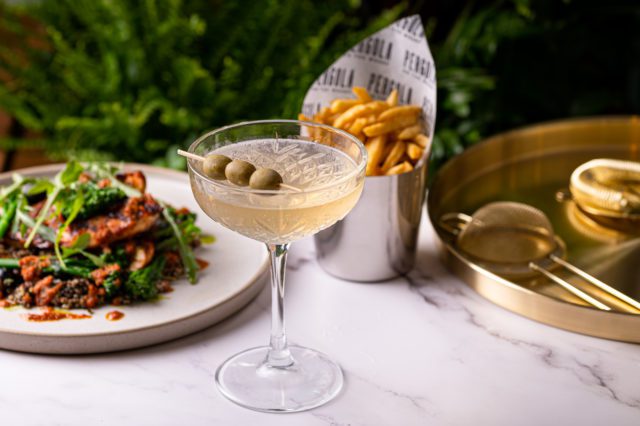 Martini with olives, chips and other delicious food at Pergola on the Wharf in London's Canary Wharf