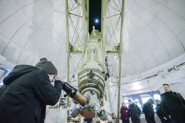 Event; A Valentines Evening Under the Stars at the Royal Observatory Greenwich: astronomers and guests enjoy looking at the moon and stars through the great equatorial telescope under the onion dome; and through telecopes in the astronomy garden besides Fl