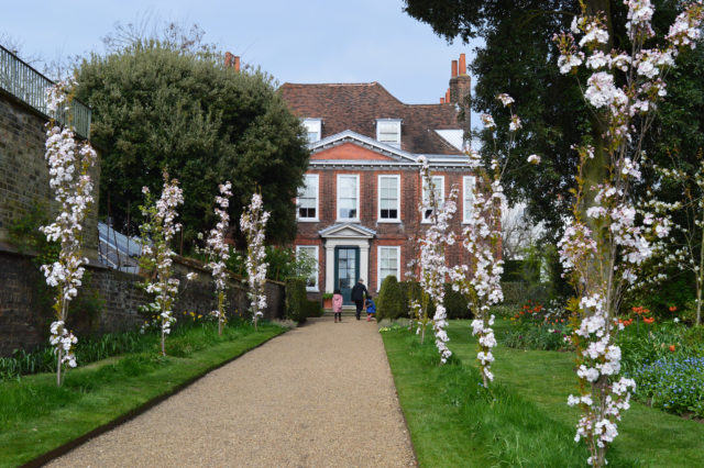 Visitors in the garden in spring at Fenton House, London, courtesy of National Trust
