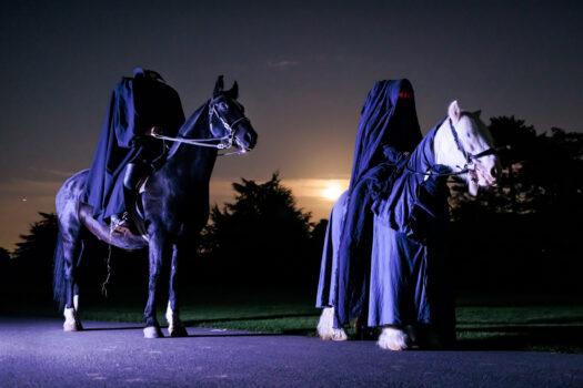 Seemingly headless riders on horseback, at Halloween at Kew