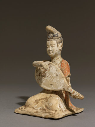 This ceramic figure of a female musician from Tangdynasty (618–907) China was intended for burial as part of a larger ensemble. She holds a pear-shaped lute that was introduced to China from India and Central Asia in earlier Emes. During the Sui (581–618) and Tang dynasties, imported music, such as from India, Bukhara and Samarkand, played using the lute and other instruments, was systematically integrated into the court music repertoire. It can be seen at the Silk Roads exhibition at The British Museum.