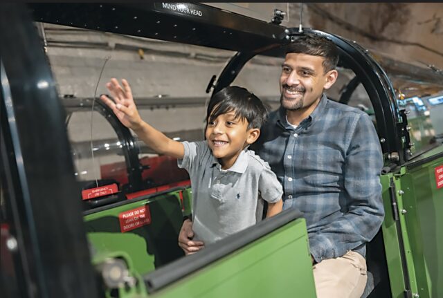 FATHER AND CHILD ON THE MAIL RAIL © THE POSTAL MUSEUM