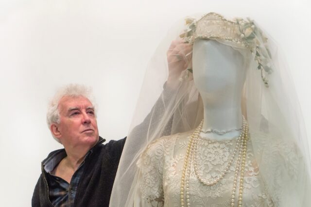 John Bright with replica wedding dress exhibit 